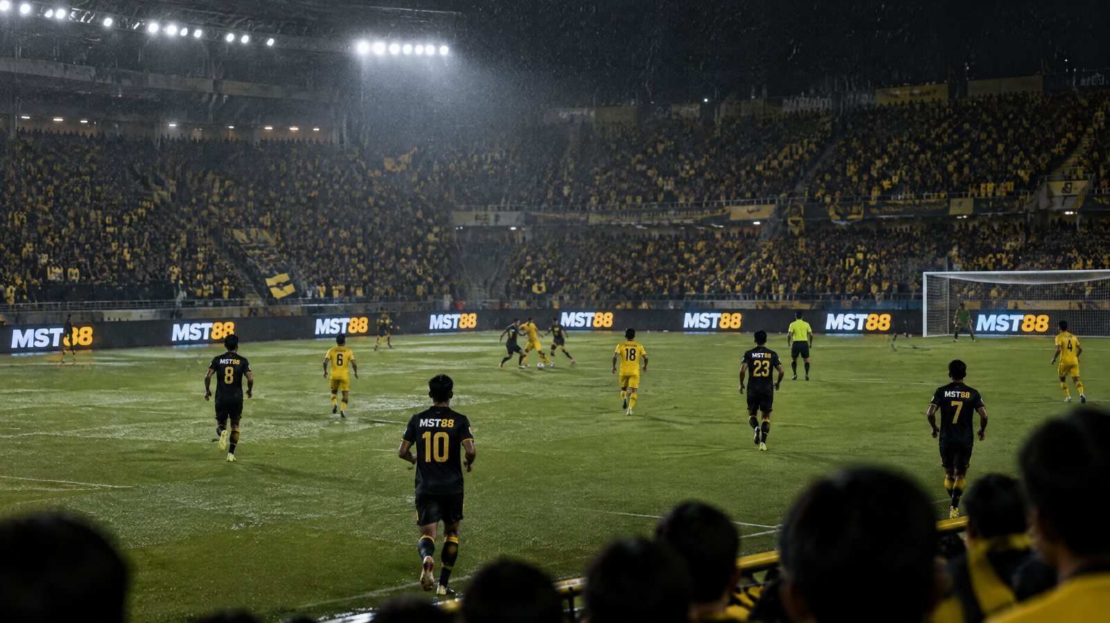 Floodlit packed stadium at night with a gold trophy on a plinth, illustrating the Piala Malaysia 2026 final